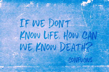 If we don't know life, how can we know death? - ancient Chinese philosopher Confucius quote printed on grunge blue paperの写真素材