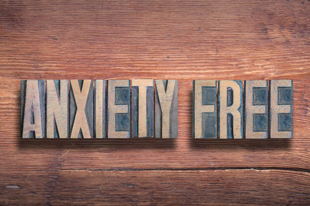anxiety free phrase combined on vintage varnished wooden surfaceの写真素材