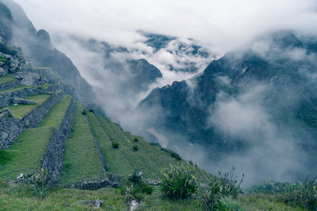 ancient Inca terraces on mountain slope at Machu Picchu site in Peruの写真素材