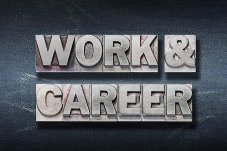 work & career phrase made from metallic letterpress on dark jeans backgroundの写真素材
