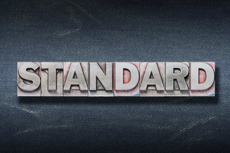 standard word made from metallic letterpress on dark jeans backgroundの写真素材