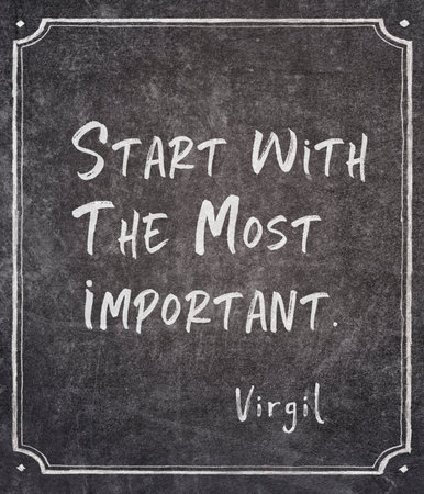 Start with the most important - ancient Roman philosopher and poet Virgil quote written on framed chalkboardの写真素材