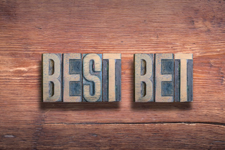 best bet phrase combined on vintage varnished wooden surfaceの写真素材