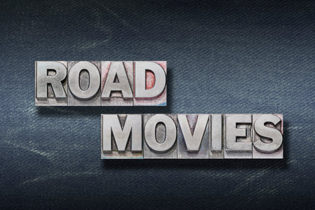 road movies phrase made from metallic letterpress on dark jeans backgroundの写真素材