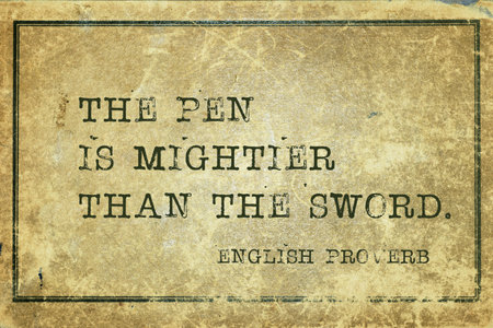 The pen is mightier than the sword - ancient English proverb printed on grunge vintage cardboardの写真素材