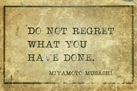 Do not regret what you have done - ancient Japanese swordsman and ronin Miyamoto Musashi quote printed on grunge vintage cardboardの写真素材