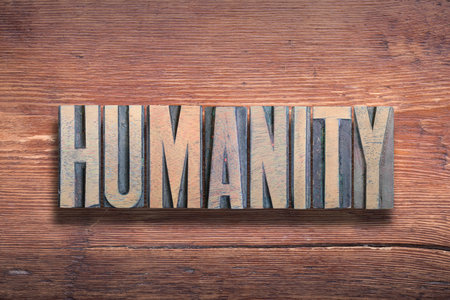 humanity word combined on vintage varnished wooden surfaceの写真素材
