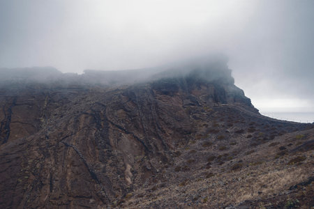 foggy mountain landscape of Madeira Island by twilightの写真素材