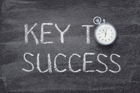 key to success phrase written on chalkboard with vintage stopwatch used instead of Oの写真素材
