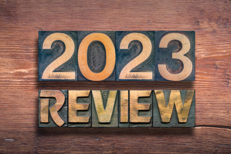 review 2023 combined from vintage letterpress on  varnished wooden surfaceの写真素材