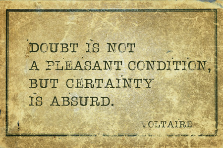 Doubt is not a pleasant condition - ancient French philosopher and writer Voltaire quote printed on grunge vintage cardboardの写真素材