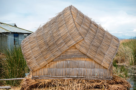 traditional reed hut from famous floating Uros islands on lake Titicaca in Peruの写真素材