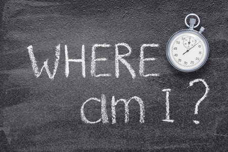 where am I question written on chalkboard with vintage precise stopwatchの写真素材