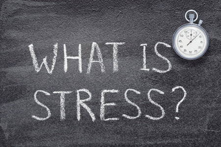 what is stress question written on chalkboard with vintage precise stopwatchの写真素材