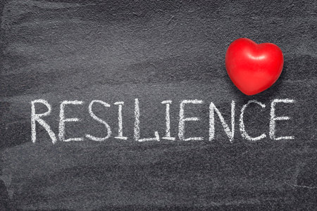 resilience word written on chalkboard with red heart symbolの写真素材