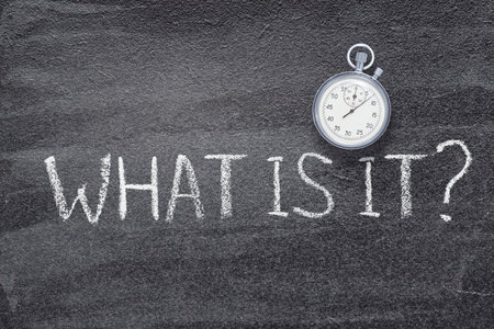 what is it question written on chalkboard with vintage precise stopwatchの写真素材