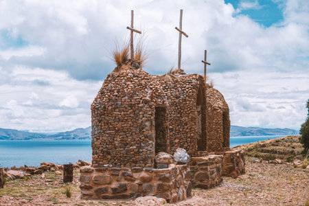 simple stone chapel atop of Isla de la Luna island at Lake Titicaca in Boliviaの写真素材