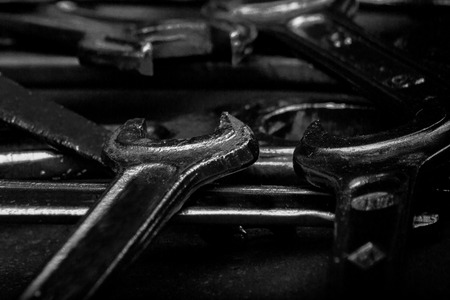 Set of black & white wrenches on black background. Repair toolsの写真素材