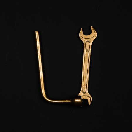 Letter U. Alphabet made of golden repair tools. Creative fontの写真素材