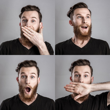 Surprised and amazed young man isolated on gray background. Emotional portraits collageの写真素材