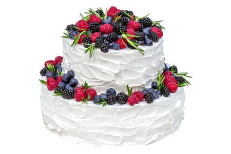 White two-tier cake with fruits isolated on white backgroundの写真素材