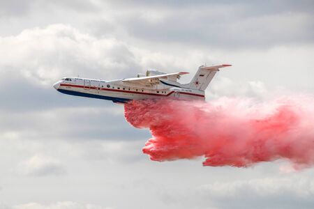 Zhukovsky, Russia - August 28, 2015: Beriev Be-200 drops colored water in flightのeditorial素材