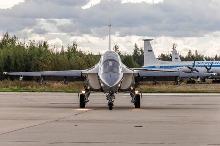 Kubinka, Russia - September 7, 2016: Yakovlev Yak-130 on the runway, in the background an old...