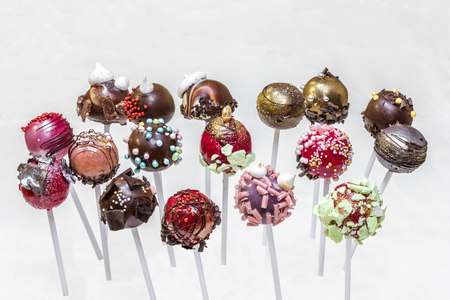 Decorated cake pops isolated on white backgroundの写真素材