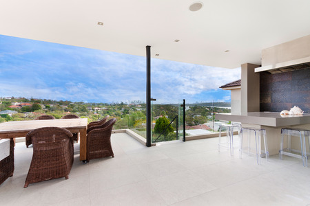 back yard with outdoor seating and barbecue with familyの写真素材