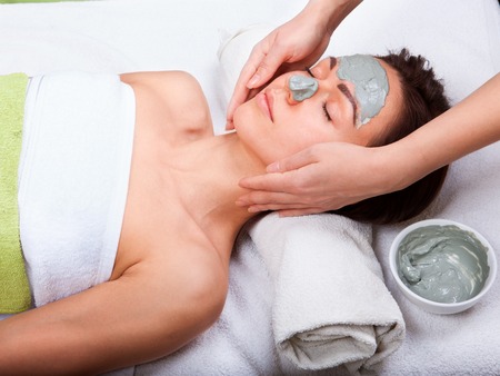 Young attractive woman getting treatment  in the spa salonの写真素材