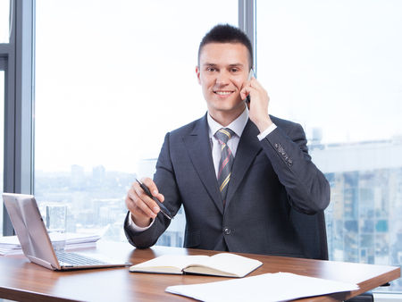 young businessman working in the Office with laptopの写真素材