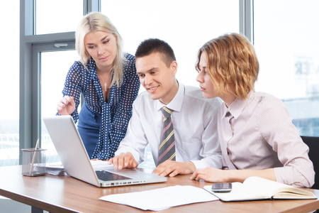 Group of businesspeople sitting and working togetherの写真素材