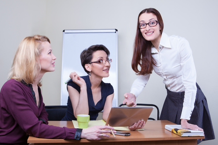Group of businesspeople sitting and working togetherの写真素材