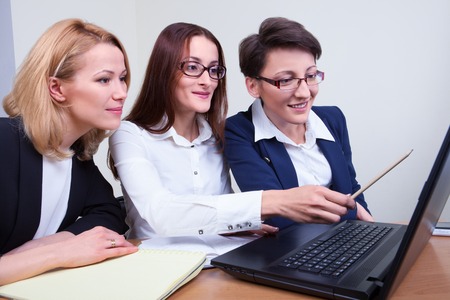 Group of businesspeople sitting and working togetherの写真素材