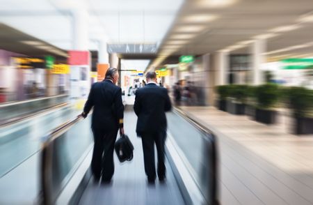 two pilots on a moving escalator の写真素材