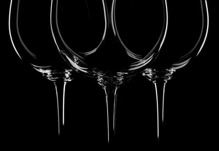three wine glasses on black background, backlitedの写真素材