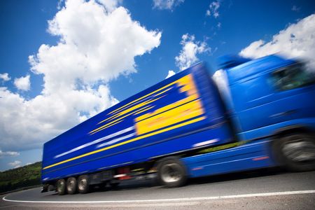 fast moving blue truck, motion blur. 16mpixの写真素材