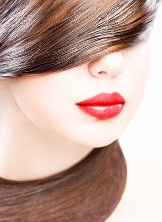 close up studio portrait of young woman, wearing red lipstickの写真素材