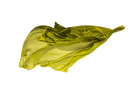 abstract pieces of olive fabric flying, high-speed studio shotの写真素材