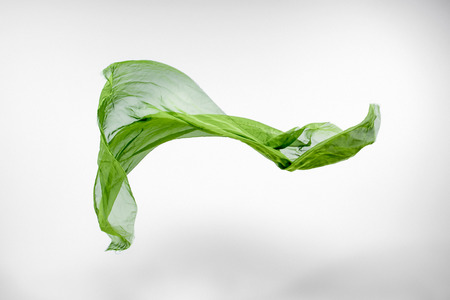 piece of green fabric flying, high speed studio shot, design elementの写真素材