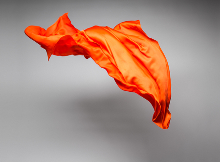 orange flying fabric - art object, design elementの写真素材