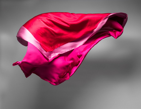 pieces of red fabric soaring, art object, design elementの写真素材