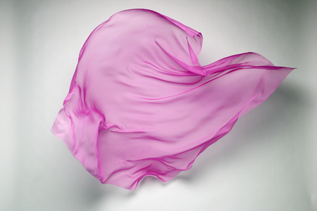 abstract piece of pink fabric flying, art object, design elementの写真素材