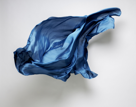 abstract piece of blue fabric flying, art object, design elementの写真素材