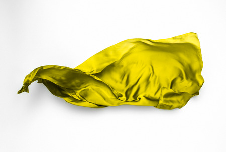 abstract piece of yellow fabric flying, art object, design elementの写真素材