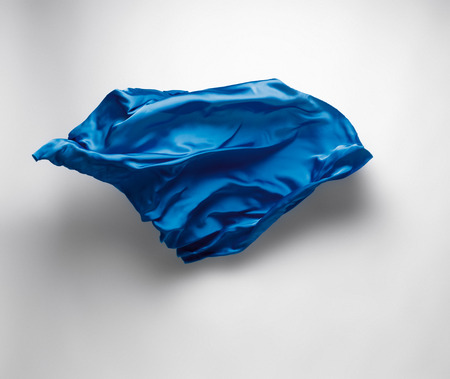 abstract piece of blue fabric flying, high-speed studio shotの写真素材