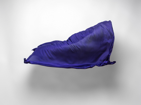 abstract piece of blue fabric flying, high-speed studio shotの写真素材