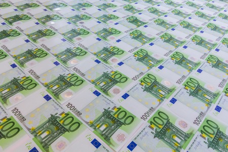 100 euro banknotes arranged into background