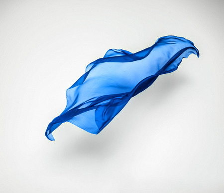 abstract piece of blue fabric flying, high-speed studio shotの写真素材