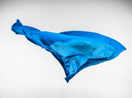 abstract piece of blue fabric flying, high-speed studio shotの写真素材